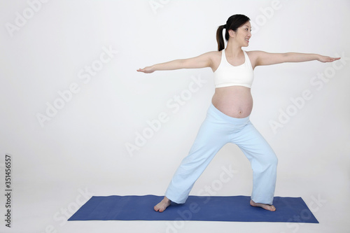 Pregnant woman practising yoga