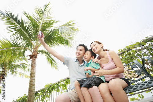 Man taking picture with his family