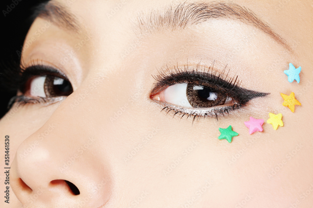 Naklejka premium Woman with stars on her face