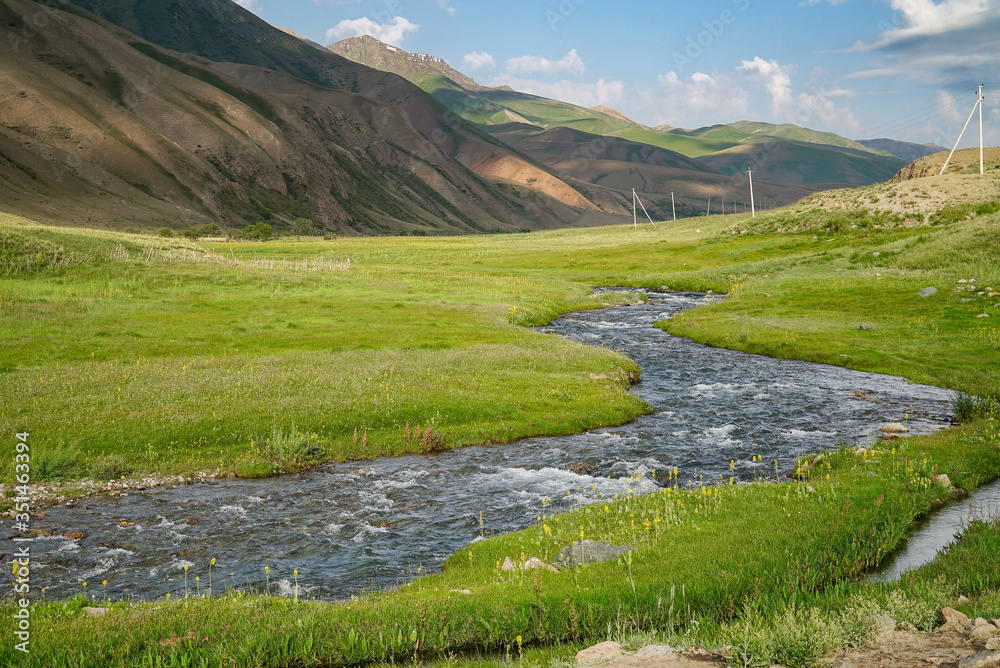 Beautiful Mountains with stream view in summer, on the way to Song Kul Lake, Kyrgyzstan Beautiful Mountains with stream view in summer, on the way to Song Kul Lake, Kyrgyzstan