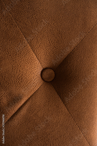 The sofa surface is made of leather.