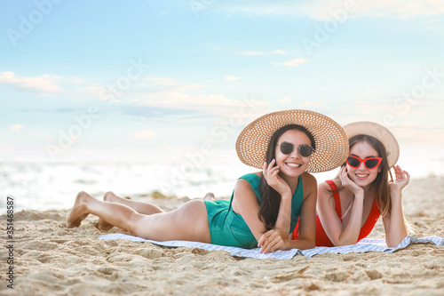 Beautiful young women lying...