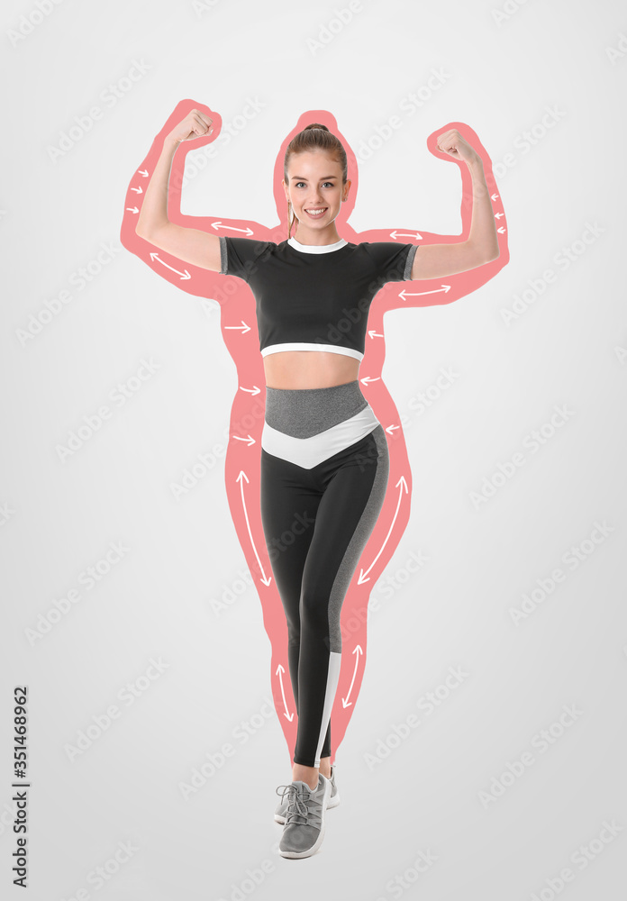 Happy sporty woman after weight loss on light background Happy sporty woman after weight loss on light background