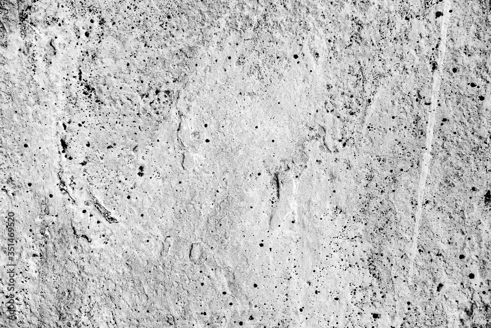Fototapeta premium Texture of a concrete wall with cracks and scratches which can be used as a background