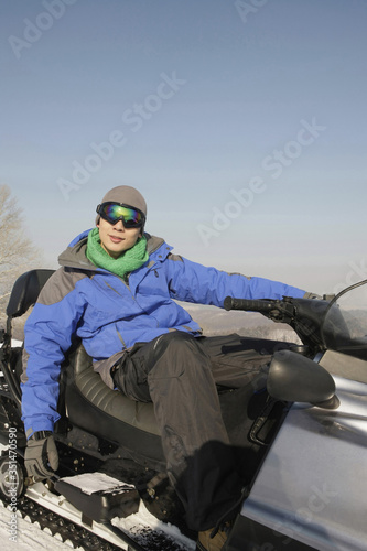 Man riding on snowmobile
