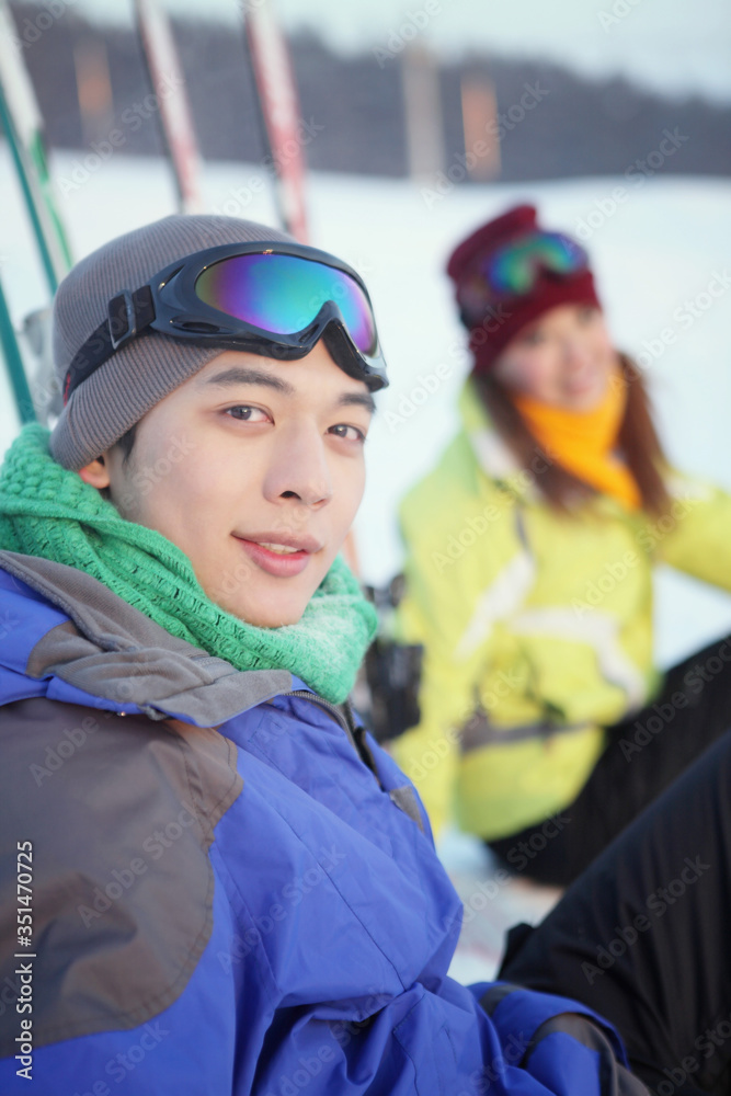 Man and woman resting after skiing Man and woman resting after skiing