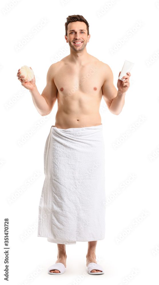 Handsome man with shower gel and sponge on white background Handsome man with shower gel and sponge on white background