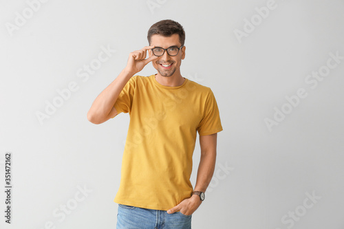 Man in stylish t-shirt on g...