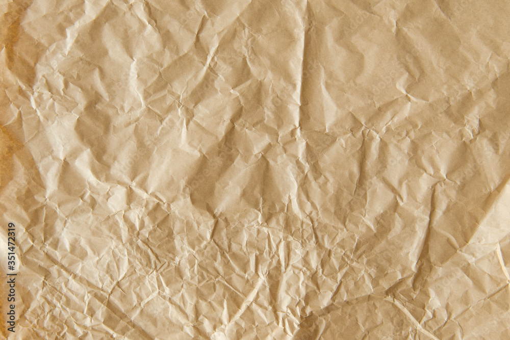 Crumpled brown paper textured background