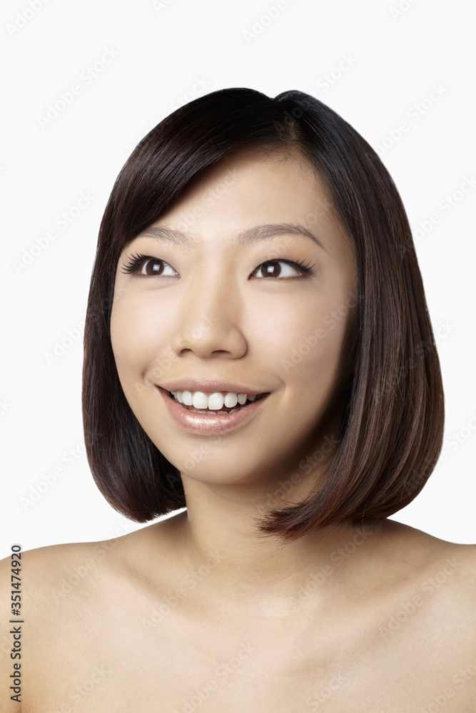Portrait of woman smiling and looking away Portrait of woman smiling and looking away
