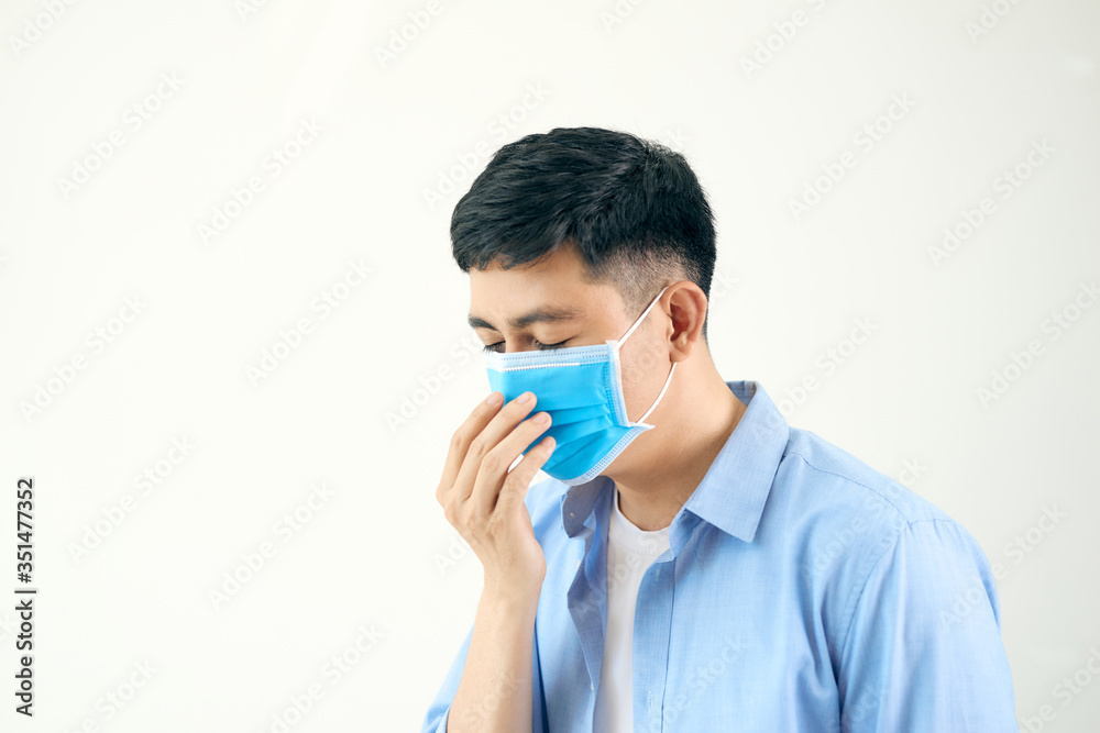 Asian man wearing a face mask with coughing Asian man wearing a face mask with coughing