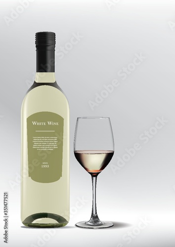 glass of white wine with bottle