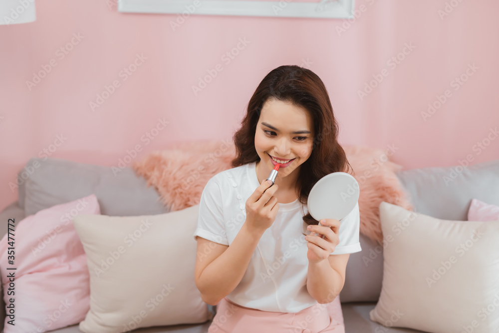 Portrait of young asian woman recording video make up lipstick cosmetic at home. Online influencer girl social media marketing live steaming concept Portrait of young asian woman recording video make up lipstick cosmetic at home. Online influencer girl social media marketing live steaming concept
