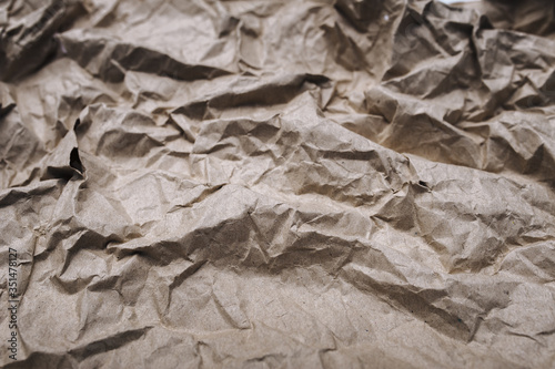 Background from crumpled light brown wrapping vintage paper.