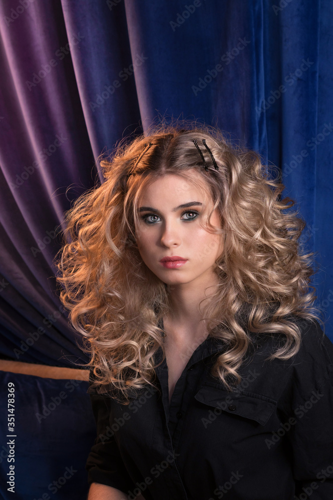 Blonde girl with long and volume shiny wavy hair. Beautiful model woman with curly hairstyle. Blonde girl with long and volume shiny wavy hair. Beautiful model woman with curly hairstyle.