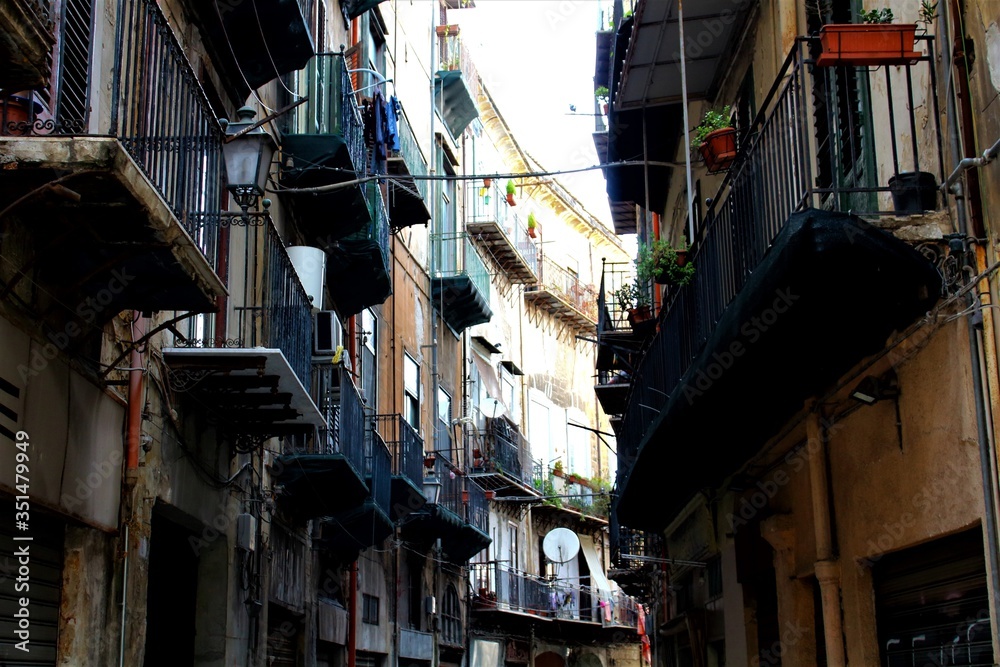 evocative image of balconies of period buildings in the historic center of Palermo in Italy
