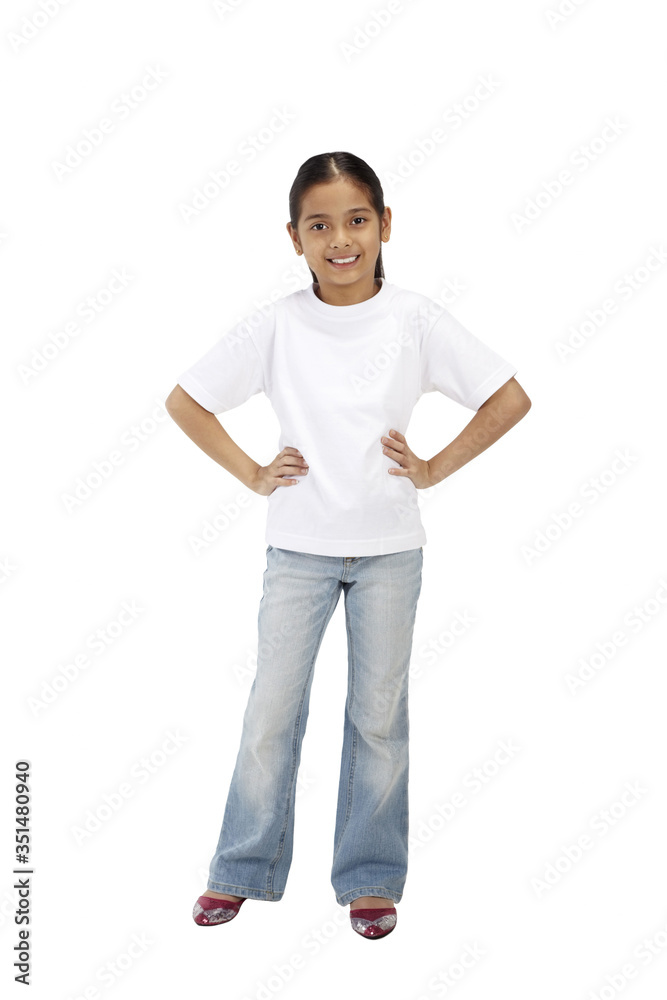Happy girl standing with arms akimbo Happy girl standing with arms akimbo