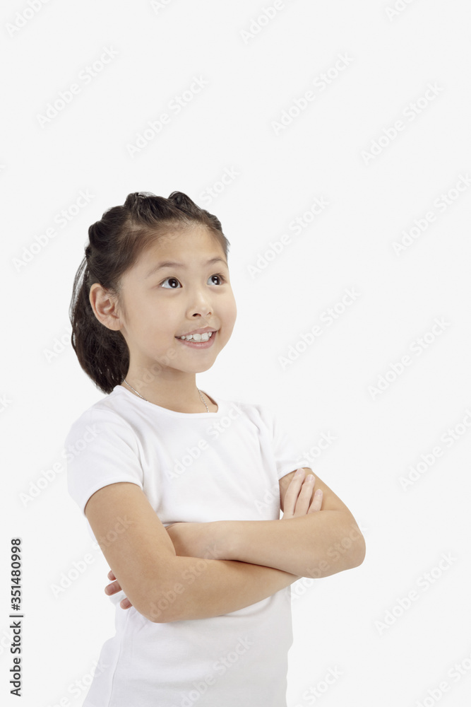 Girl smiling with arms across her chest