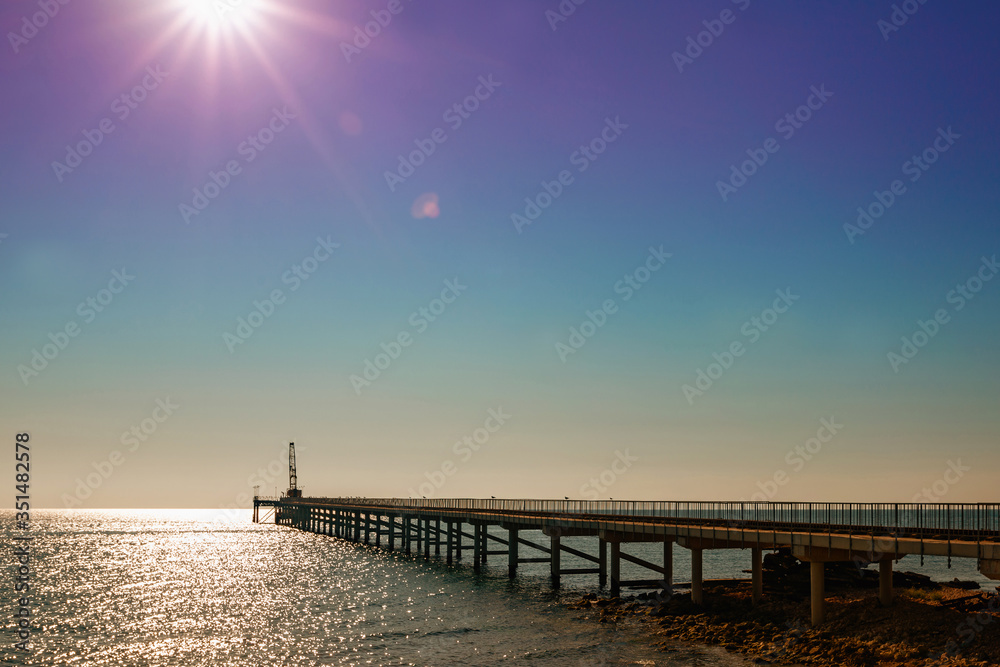 the pontoon on the sea at sunrise