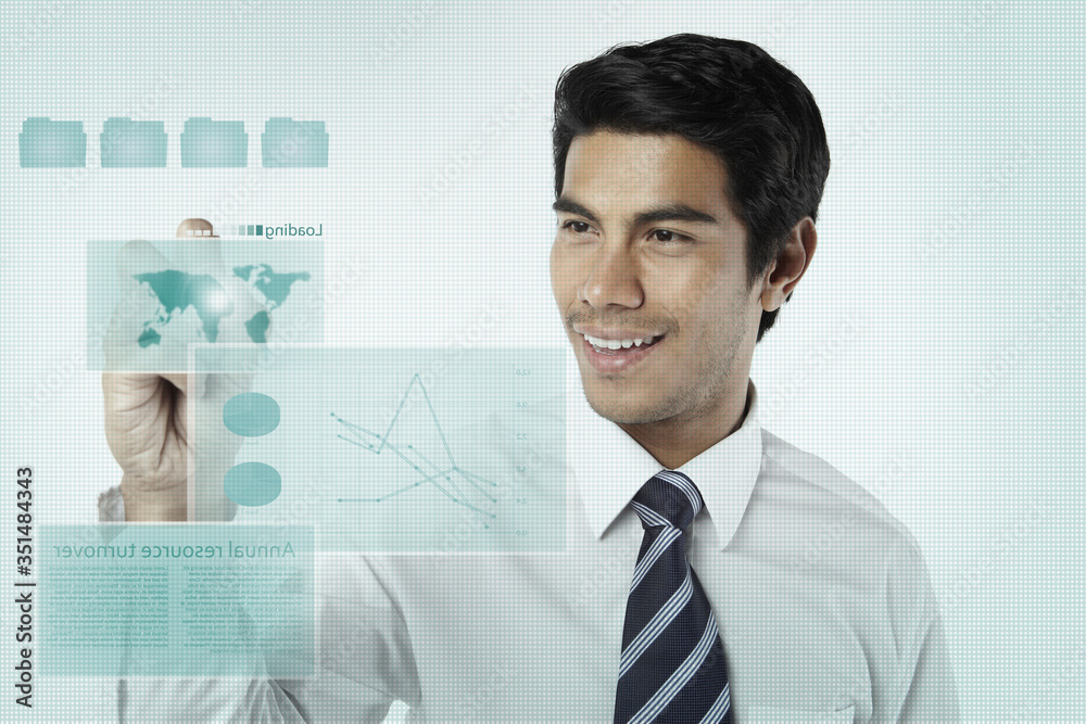 Young businessman using a virtual screen Young businessman using a virtual screen
