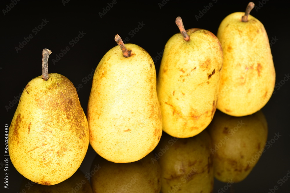 Juicy sweet, organic pears, close-up, on a black background. Juicy sweet, organic pears, close-up, on a black background.