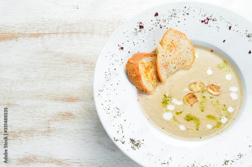 Mushroom cream soup. Top view. Free space for your text. Mushroom cream soup. Top view. Free space for your text.