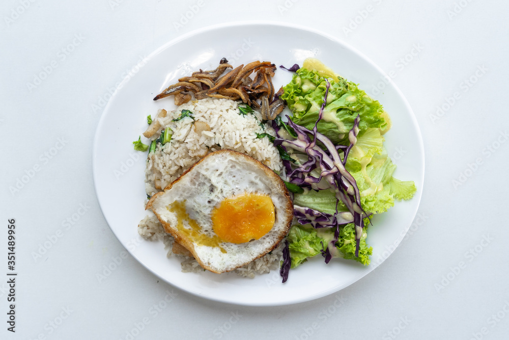 Food photography with white background, Top angle of asian food. Rice, salad, fried eggs, anchovy fried