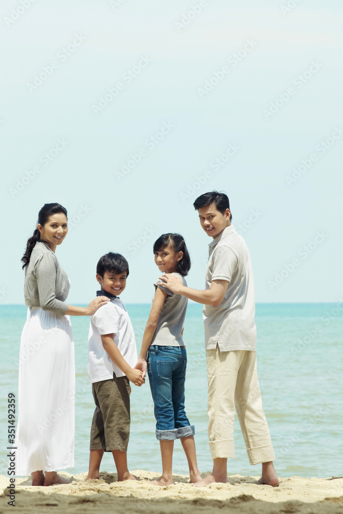 Family enjoying the beautiful view on the beach Family enjoying the beautiful view on the beach