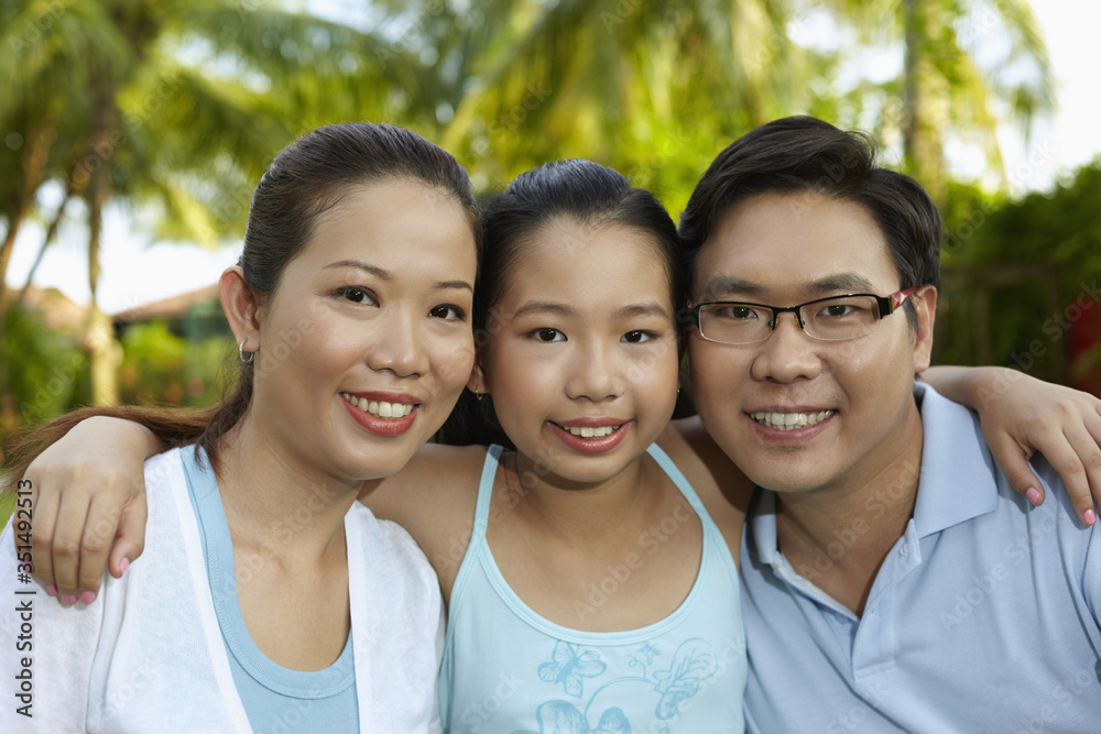 Girl posing with her parents