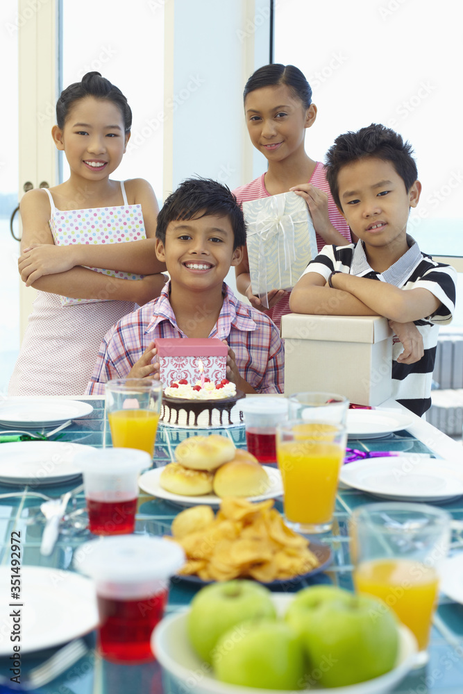 Children celebrating boy's birthday Children celebrating boy's birthday