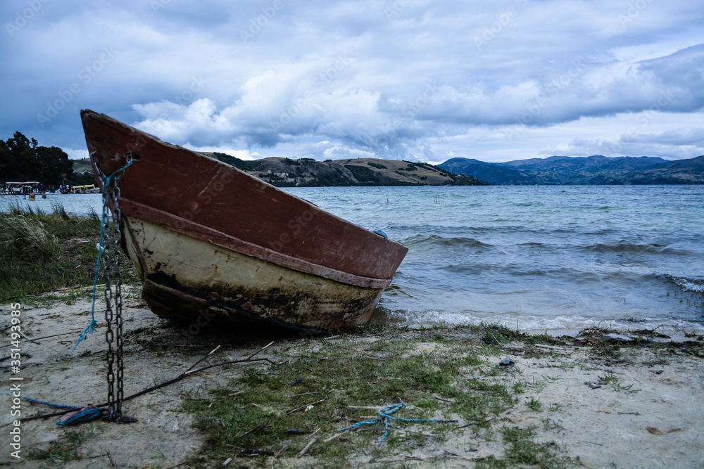 old boat on the shore of lake