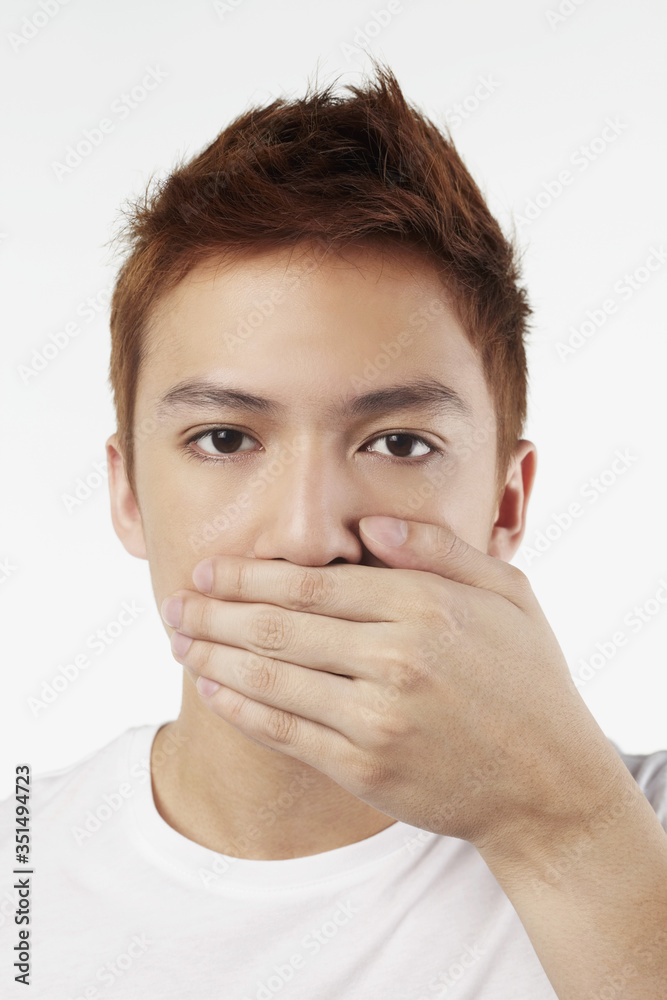 Man covering his ears depicting the quote 'Speak No Evil' Man covering his ears depicting the quote 'Speak No Evil'