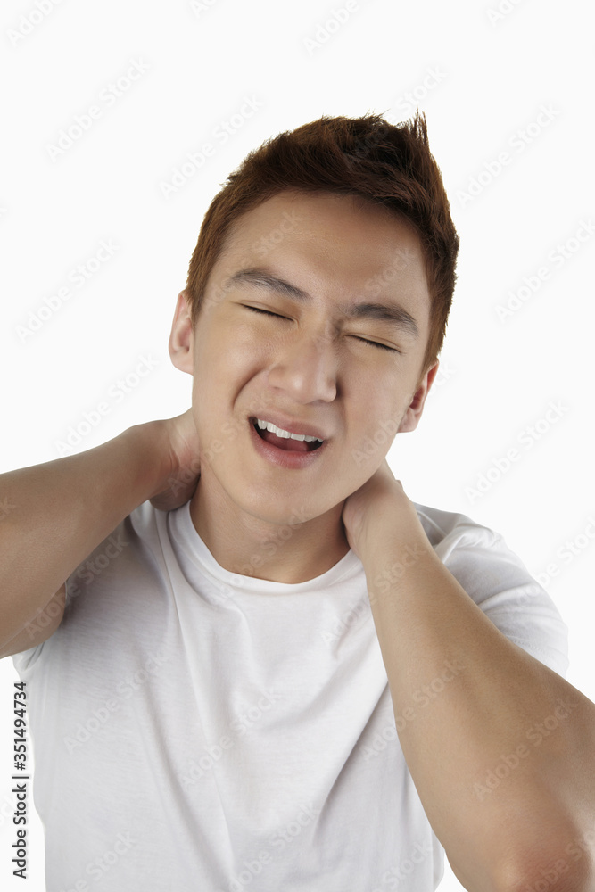 Man rubbing sore neck Man rubbing sore neck