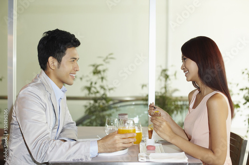Woman and man eating together