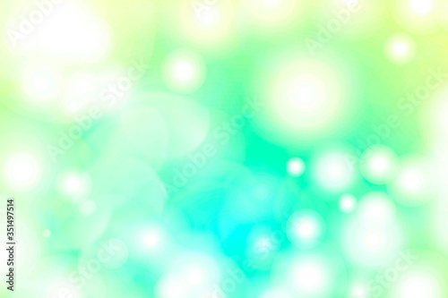 White bokeh light on a greenish background
