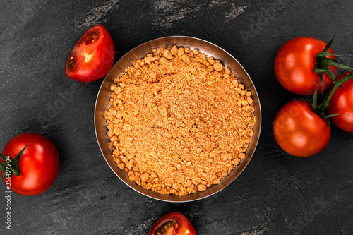 Tomato Powder (close up; selective focus) on vintage background photo