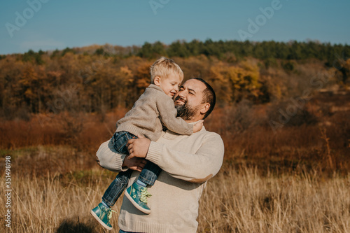 Father's day, Happy loving family. Father and son playing, having fun on the nature. Happy family, Fathers Day and local summer vacation