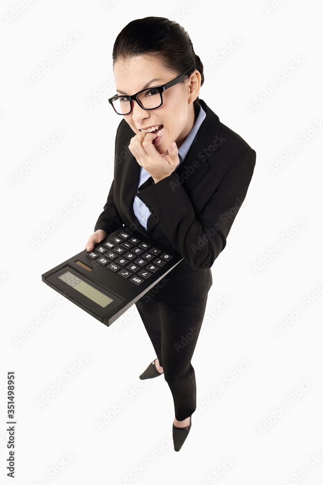 Businesswoman holding a calculator Businesswoman holding a calculator