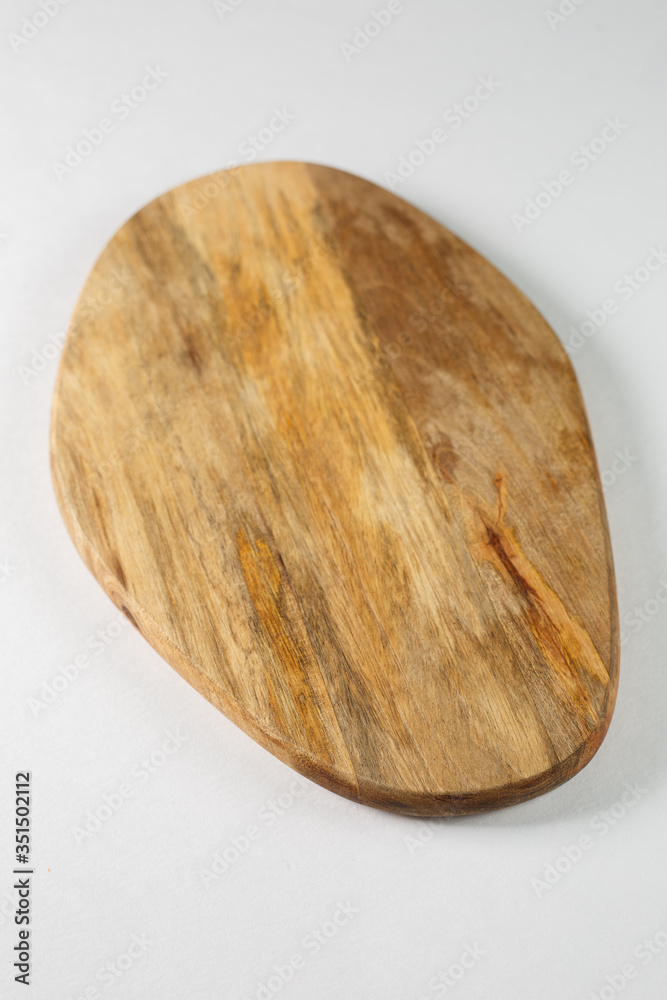Brown board for slicing food on a white background