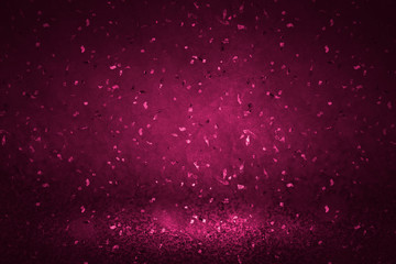 Pink confetti on a magenta background
