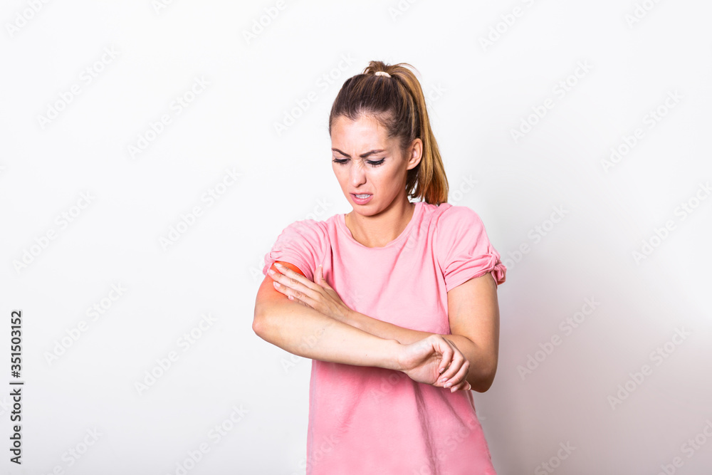 Women scratch the itch with hand , Concept with Healthcare And Medicine. Woman scratching arm on grey background. Allergy symptoms. Woman scratching her arm. Women scratch the itch with hand , Concept with Healthcare And Medicine. Woman scratching arm on grey background. Allergy symptoms. Woman scratching her arm.