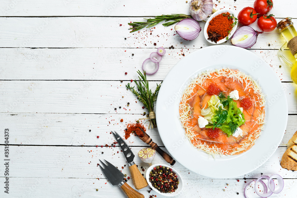 Salmon carpaccio with red caviar. Top view. Free space for your text. Salmon carpaccio with red caviar. Top view. Free space for your text.