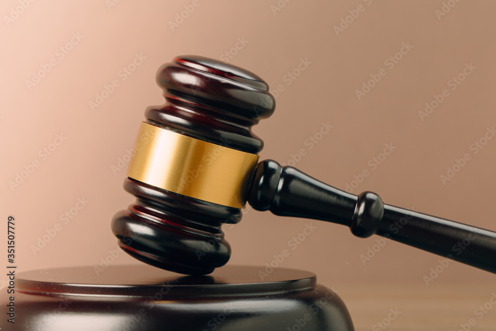 Symbol of law and justice on wooden table in lawyer office Symbol of law and justice on wooden table in lawyer office