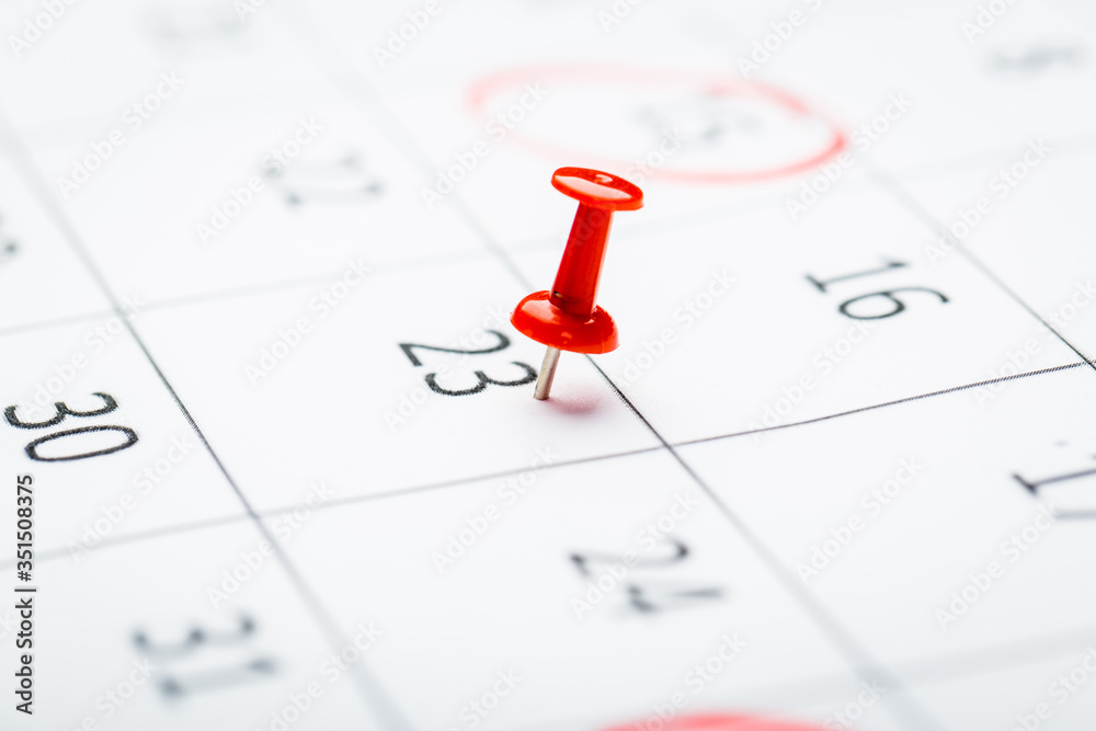 2020 calendar page marked with an important date in red pin. timeline, time, concept, idea, management 2020 calendar page marked with an important date in red pin. timeline, time, concept, idea, management
