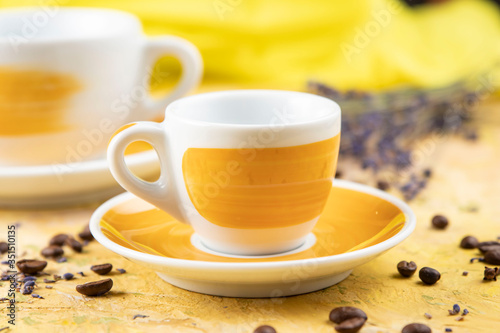 yellow coffee cup on yellow background