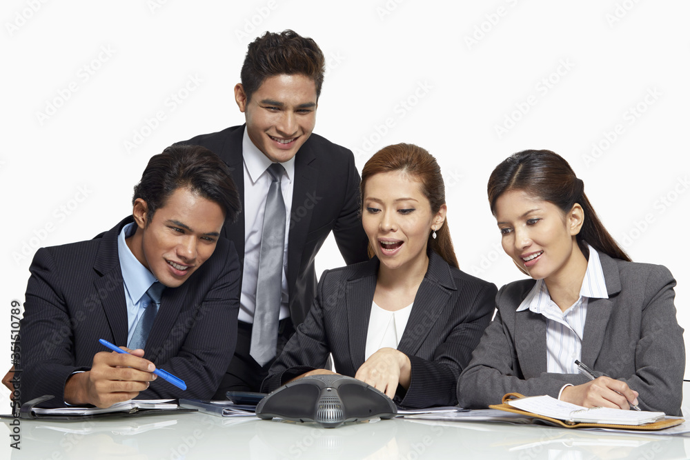 Businessmen and businesswomen having a teleconference call Businessmen and businesswomen having a teleconference call