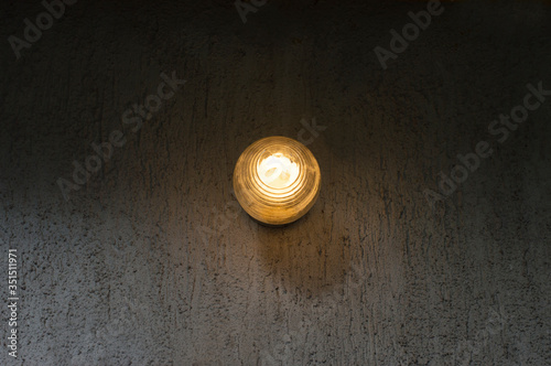 old lamp on dark wall