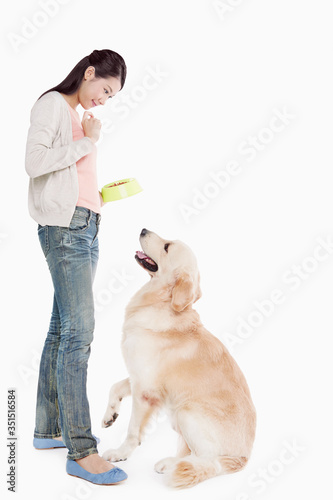 A dog pet with a young woman owner