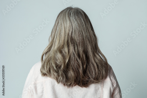 Bild auf Leinwand Rear view of a senior woman with gray hair