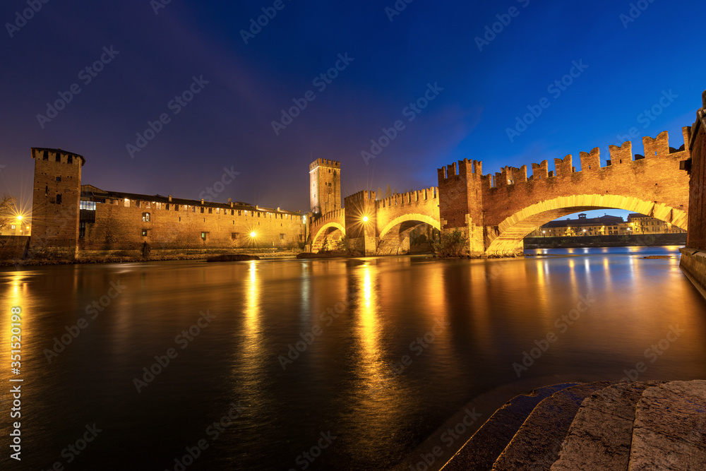 Castelvecchio and Ponte Scaligero (Old Castle and Scaligero bridge), at night with the River Adige in Verona downtown, UNESCO world heritage site, Veneto, Italy, Europe